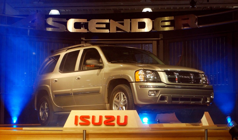 The Isuzu Ascender release event - featuring a silver SUV backlit with blue lights. 
