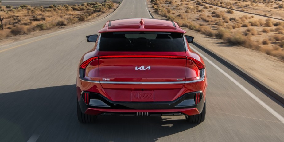 The back of a red Kia EV6 small electric SUV.