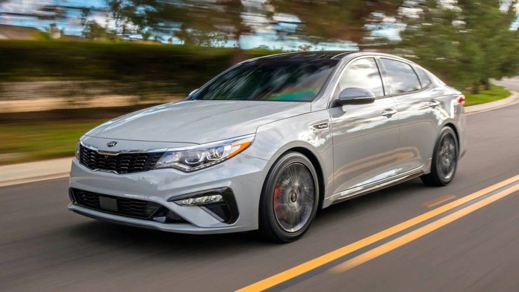 Kia Optima, most reliable midsize car, says J.D. Power, not Honda Accord or Toyota Camry, driving on road 
