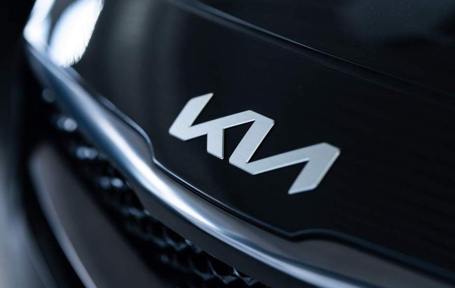 A black Kia with the Kia logo displayed.