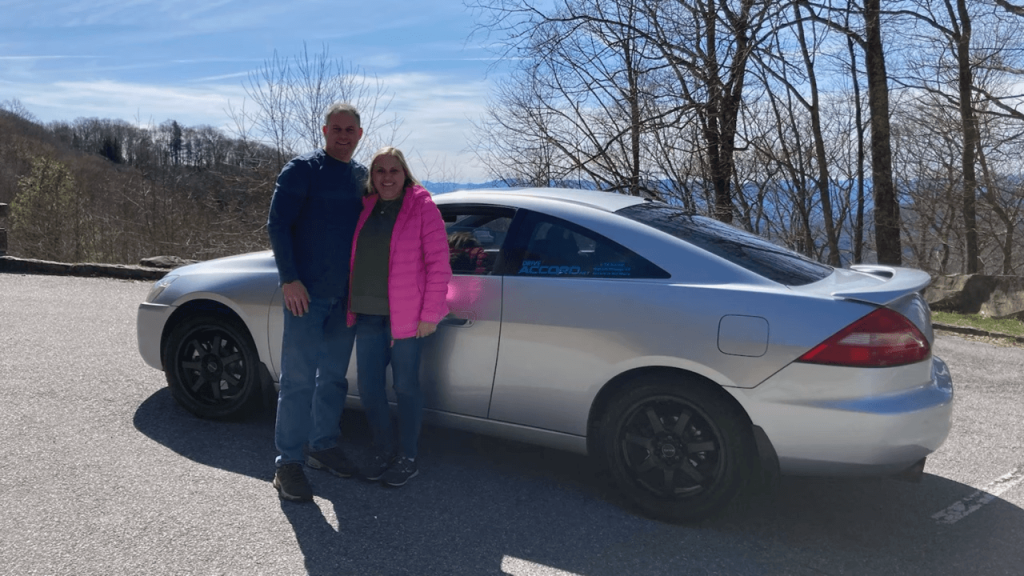 Justin Kilmer and wife in front of the million-mile Honda Accord