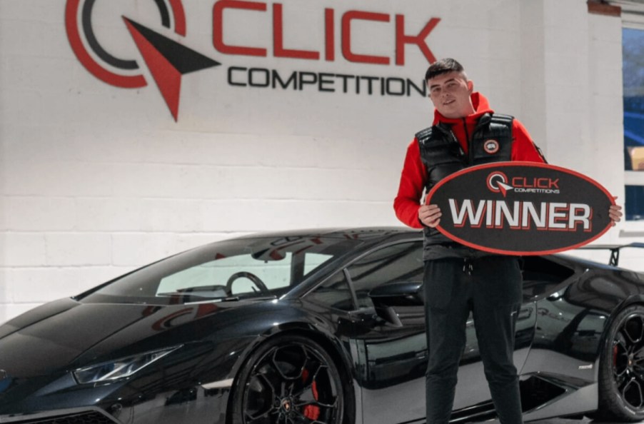 Lamborghini Hurracan Winner pictured standing next to his black supercar.