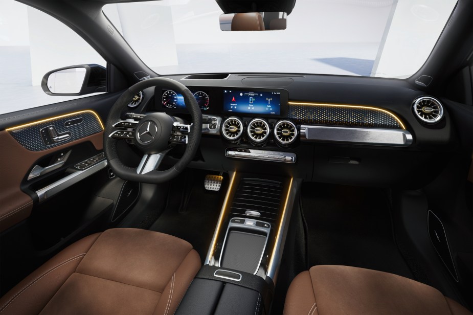 The 2024 Mercedes-Benz GLB interior with brown leather and black and silver trim. 