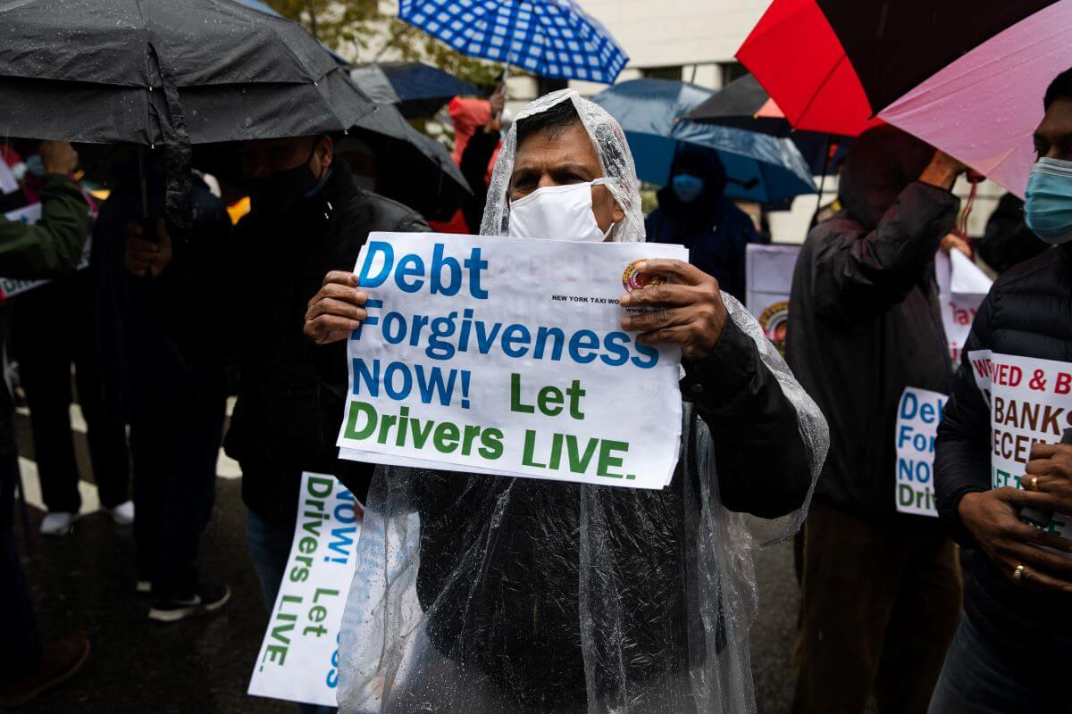A New York City taxi driver demonstrater at a rally demanding debt relief at Gracie Mansion