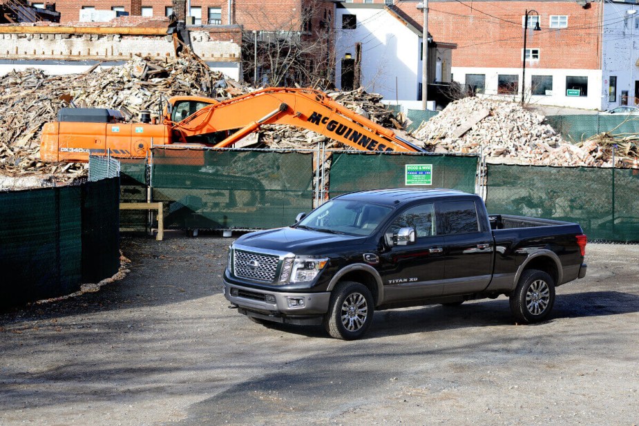 As a truck with a Cummins diesel engine, the Nissan Titan XD sits at a construction site.