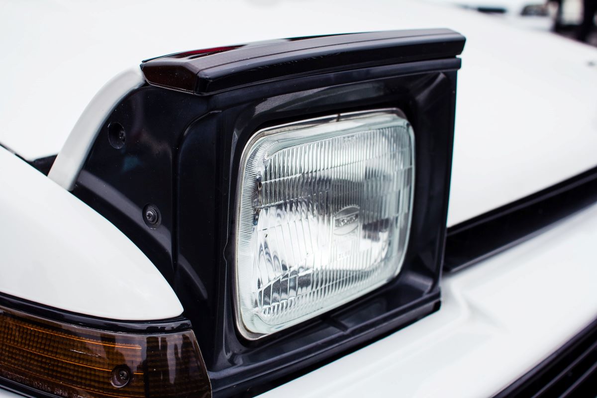 Pop-up headlights on a white car