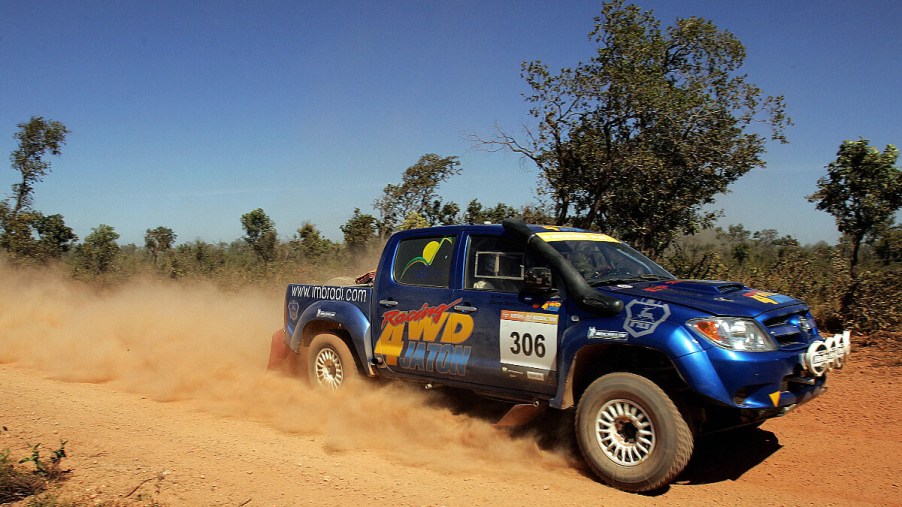 A Toyota Hilux midsize truck shows how tough it is at a rally.