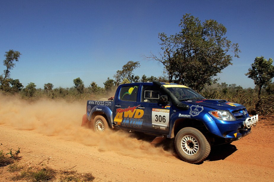 A Toyota Hilux midsize truck shows how tough it is at a rally.