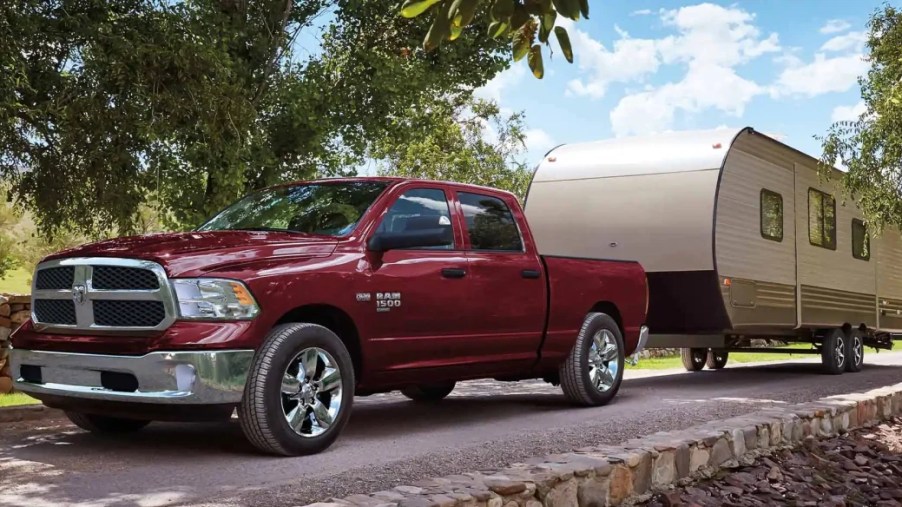 The Ram 1500 Classic tows a trailer as one of the cheapest trucks in 2023.