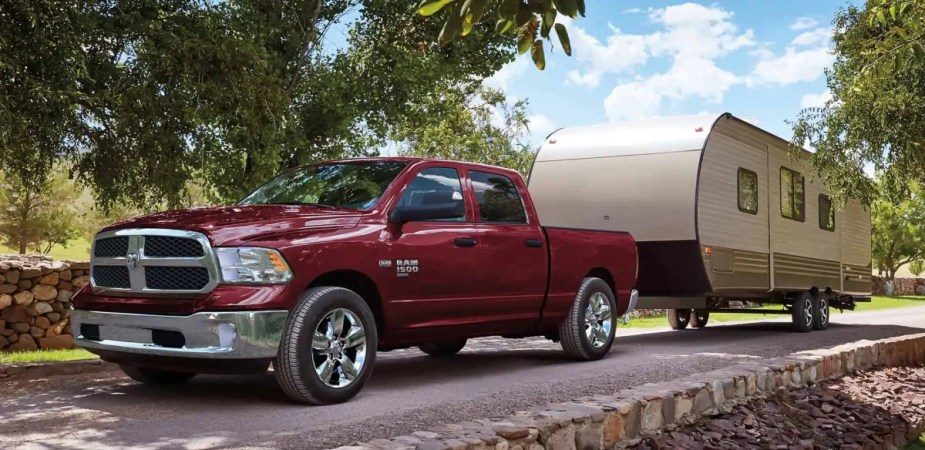 The Ram 1500 Classic tows a trailer as one of the cheapest trucks in 2023.