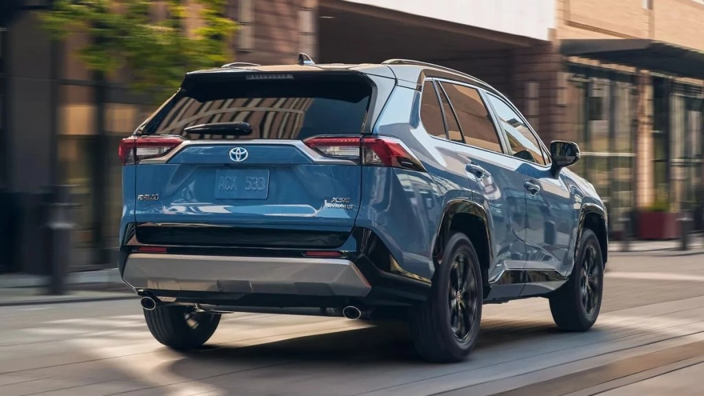 Rear angle view of blue 2023 Toyota RAV4 compact crossover SUV