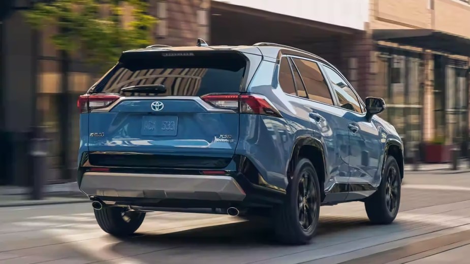 Rear angle view of blue 2023 Toyota RAV4 compact crossover SUV
