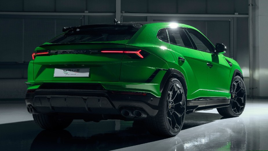 Rear angle view of green 2023 Lamborghini Urus, most affordable new Lamborghini car in 2023 and one of fastest SUVs