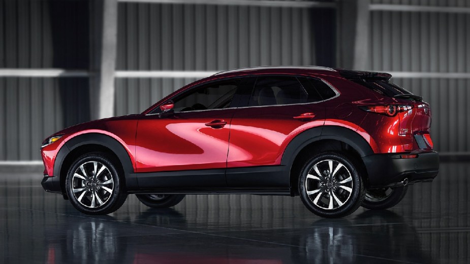 Side view of red 2023 Mazda CX-30 crossover SUV