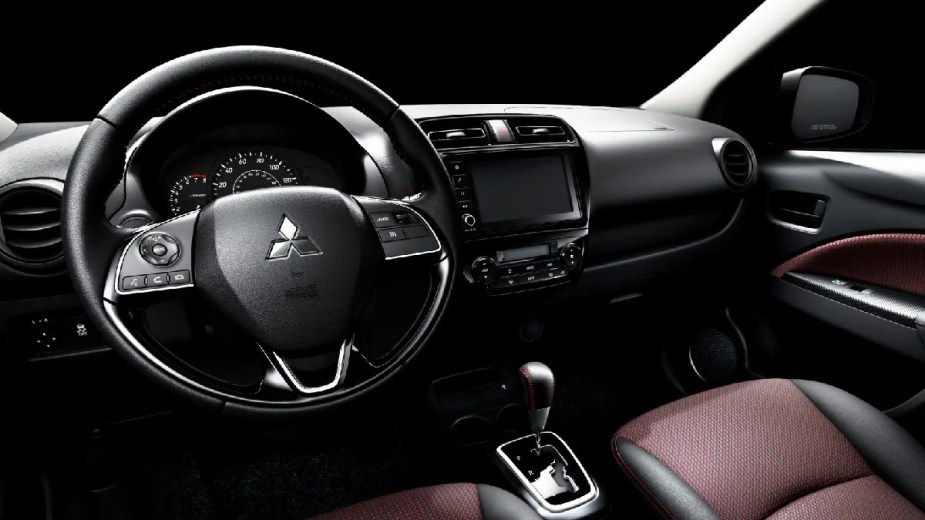 Steering wheel in 2023 Mitsubishi Mirage, gas car with best gas mileage and one of most affordable new models