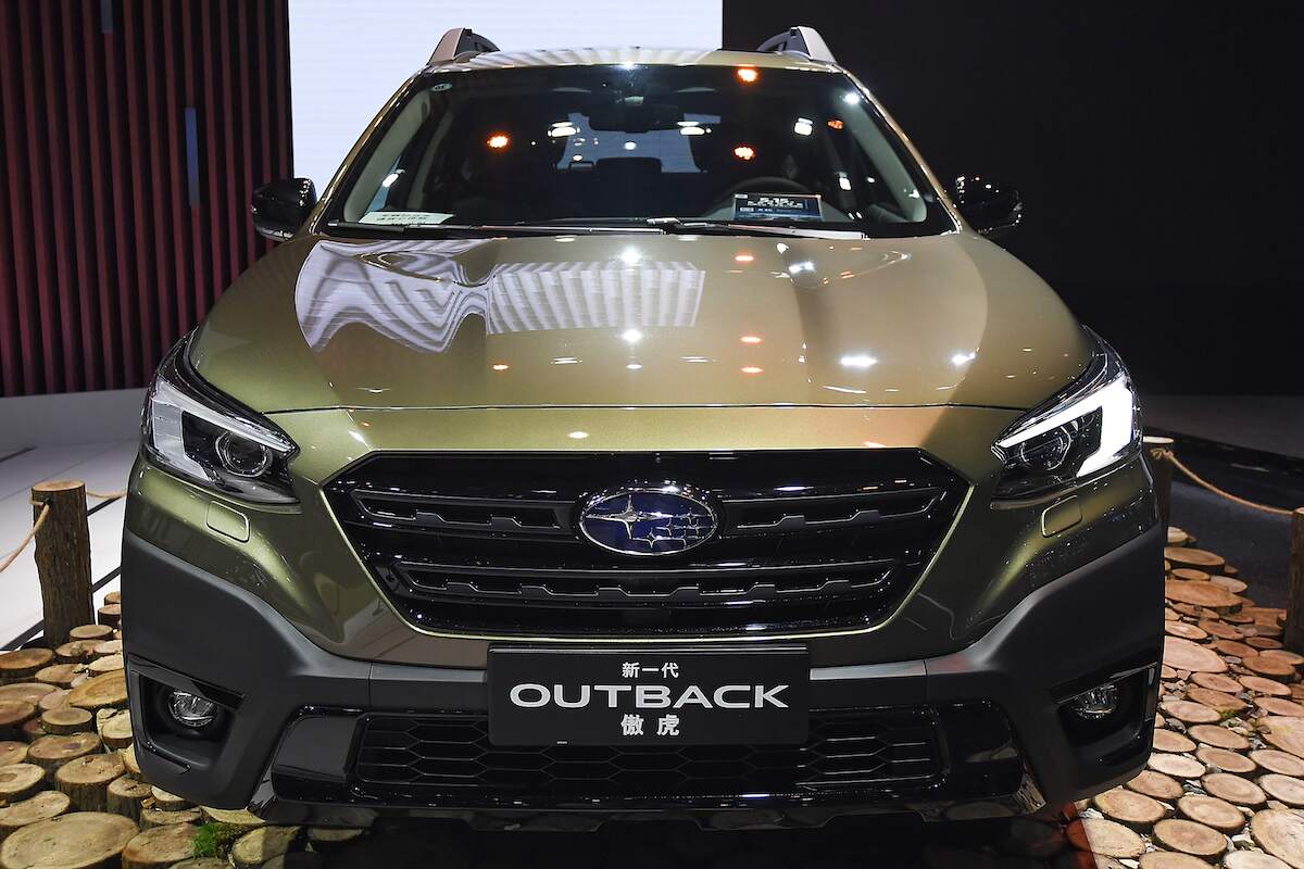 A Subaru Outback parked indoors.