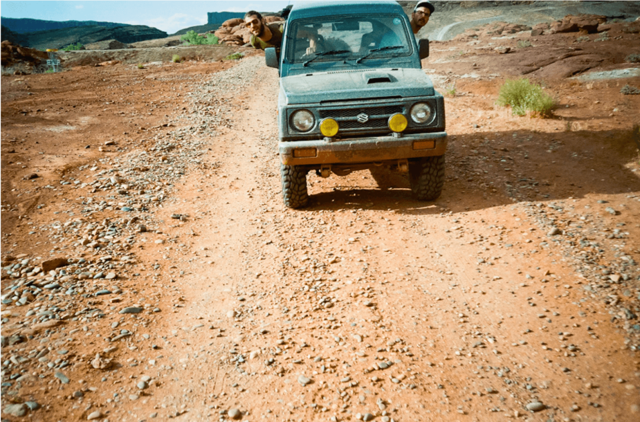 Peter Corn and Neal Thompson driving a second-gen Suzuki Jimny through Moab