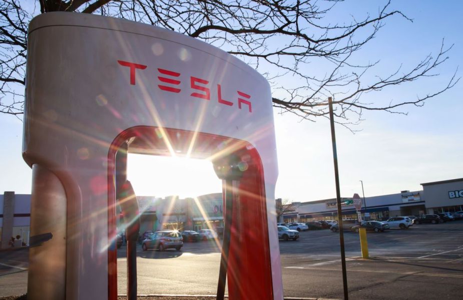 A Tesla Charging Network station with the glare from a sunset in Union City, New Jersey