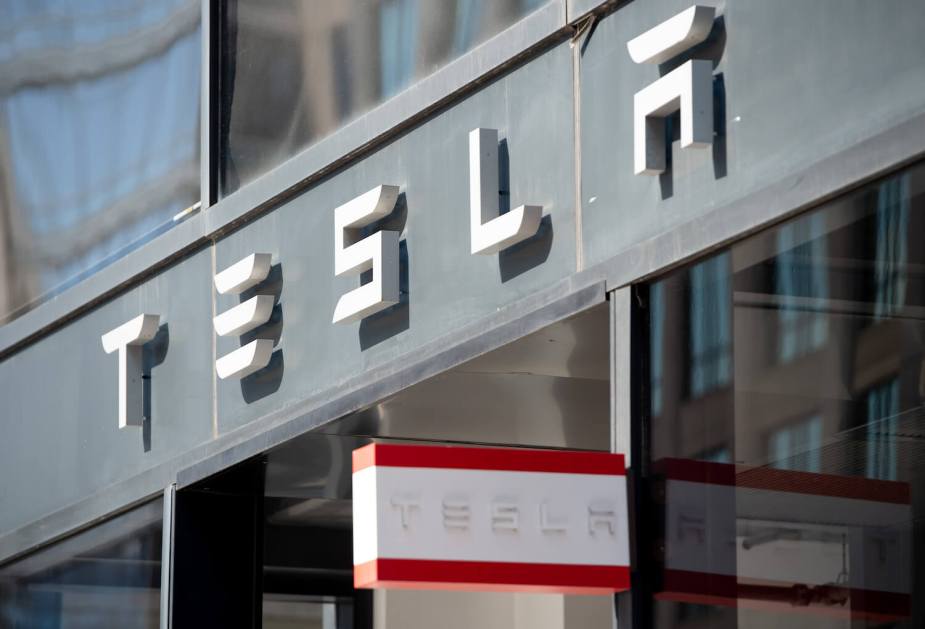 The Tesla logo above the door of an EV showroom in Washington D.C.