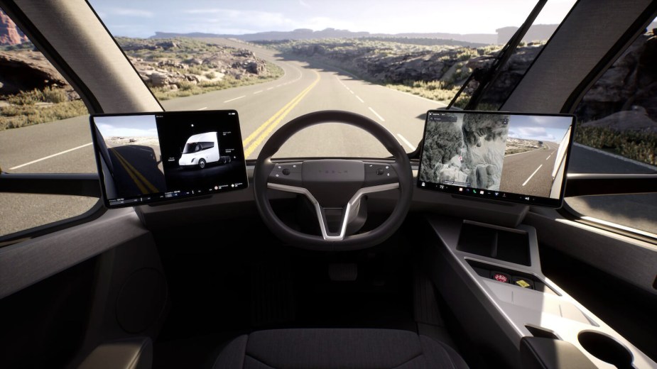 Tesla's promo photo of the large infotainment screens in the cab of its Semi truck, which seem to be failing.