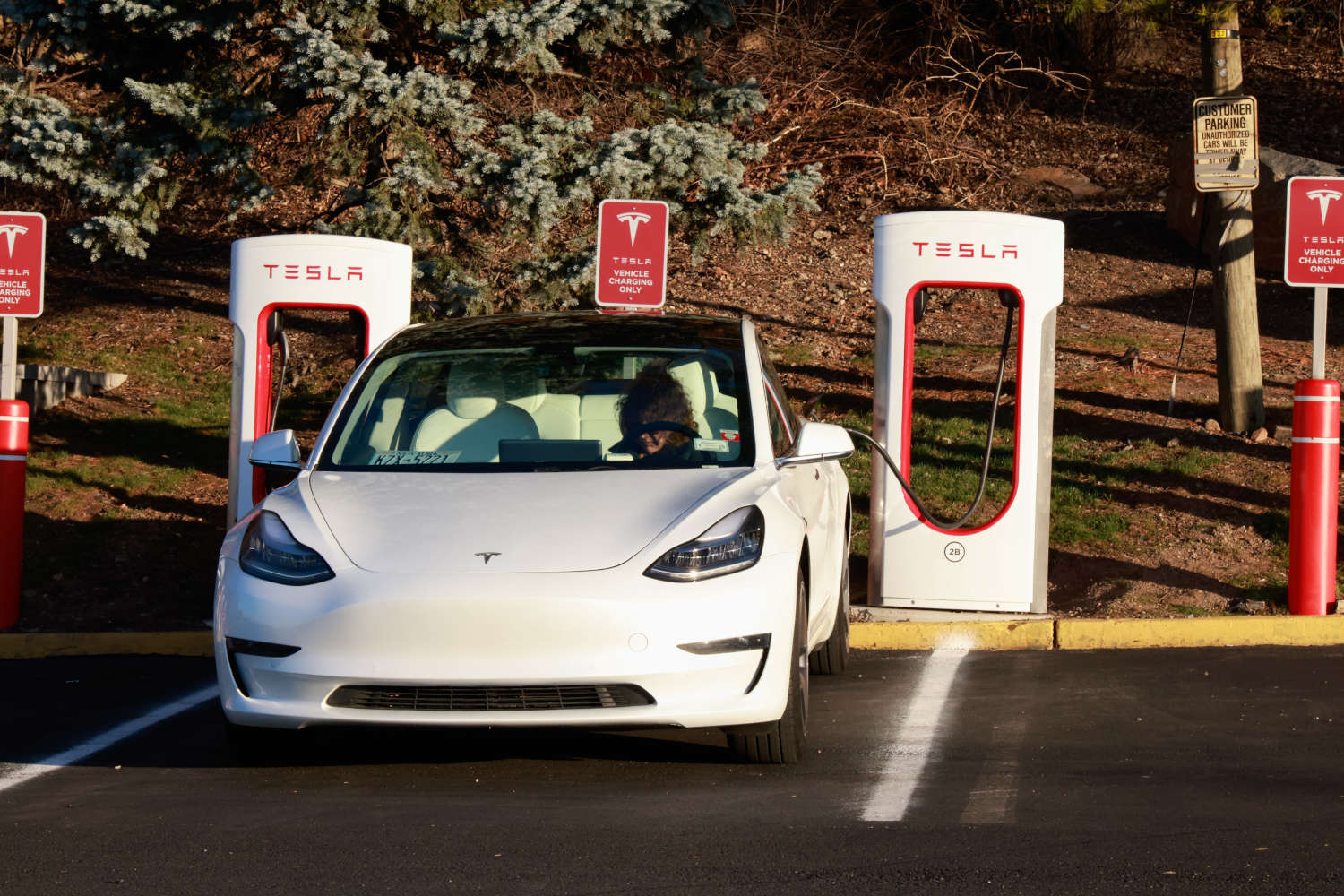 The Tesla Supercharger Network charging a Tesla EV