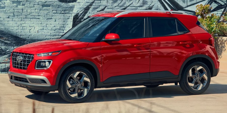 A red 2023 Hyundai Venue subcompact SUV is parked. 