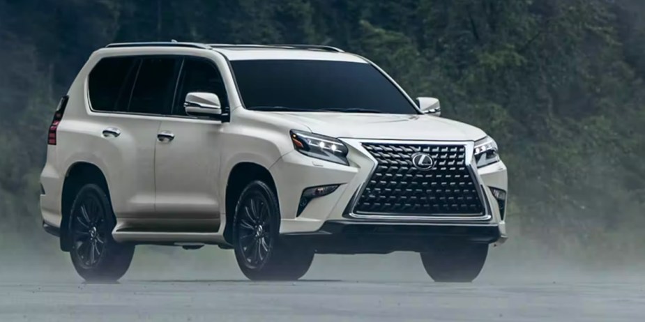 A white 2023 Lexus GX full-size SUV is parked. 