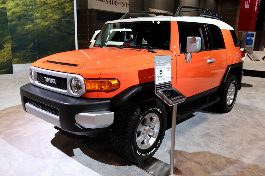 The Toyota FJ Cruiser in Orange. It's an iconic Toyota SUV.