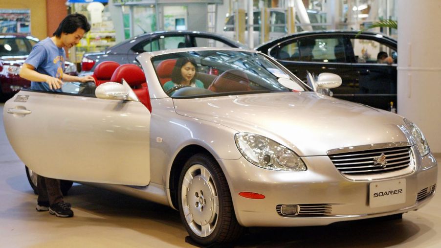 A Toyota Soarer (Lexus SC) convertible with its griffin/lion emblem logo in Tokyo, Japan