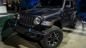 The new Jeep Wrangler with the 4xe engine in dark grey with blue accents.