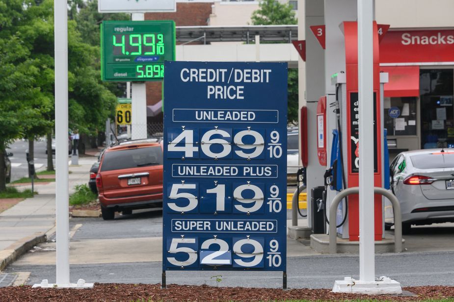 a blue sign showing gasoline prices in D.C. This shows the price difference between premium gasoline and regular. 