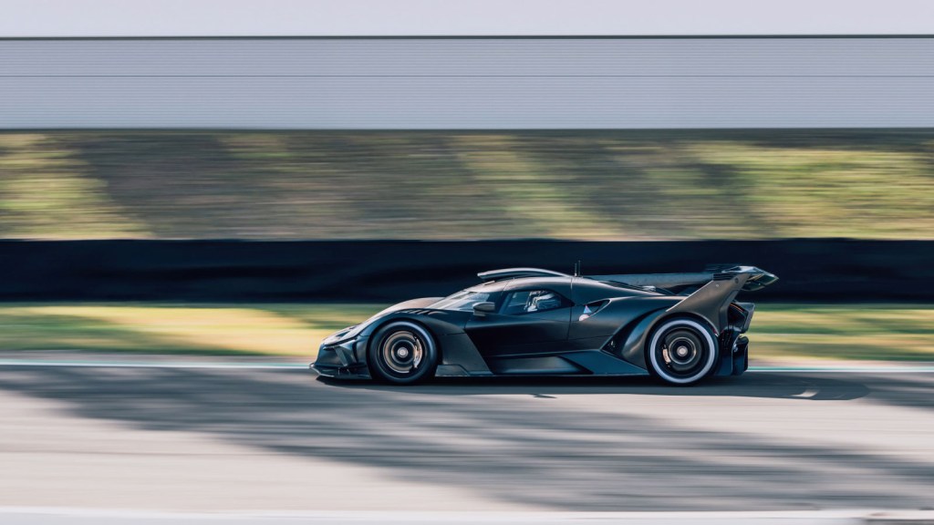 A black Bugatti Bolide on a race track