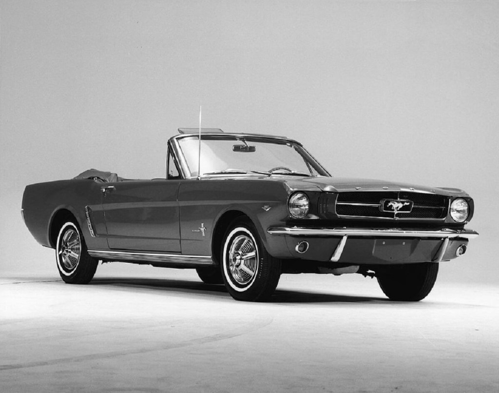 A black 1965 Ford Mustang Convertible on the anniversary of its release. 
