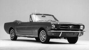 A black 1965 Ford Mustang Convertible on the anniversary of its release.
