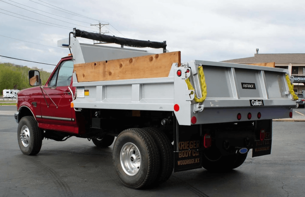 Red 1997 Ford F-350 dump bed truck 