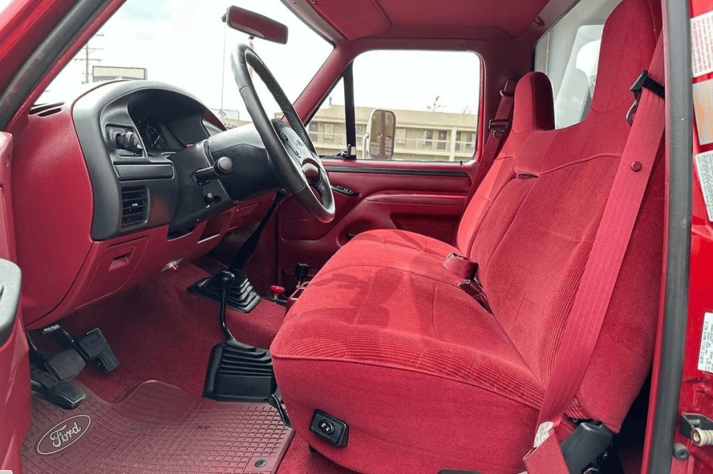 Red 1997 Ford F-350 dump bed truck