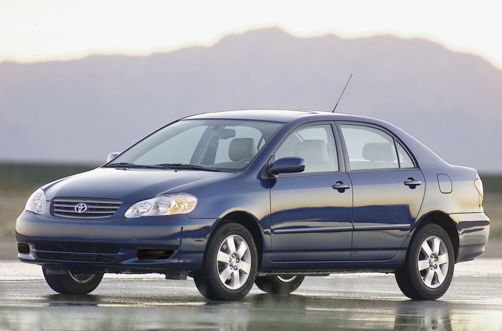 A blue used 2003 Toyota Corolla shows off its fascia. 