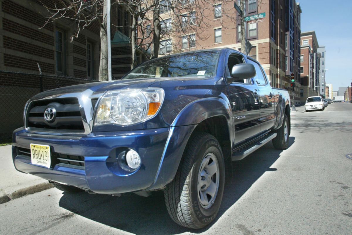 A 2005 Toyota Tacoma parked on the side of the road.