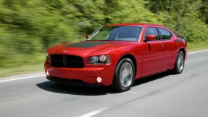 A 2006 Dodge Charger Daytona cruises down back roads.