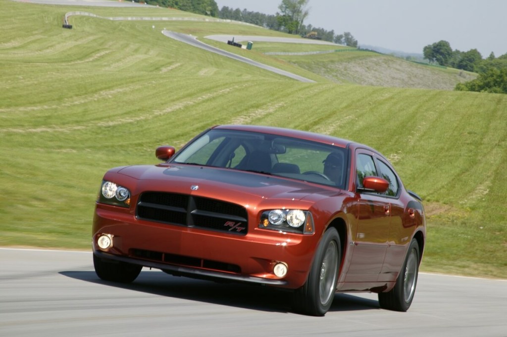 A used 2006 Dodge Charger R/T sedan drives around a test track.