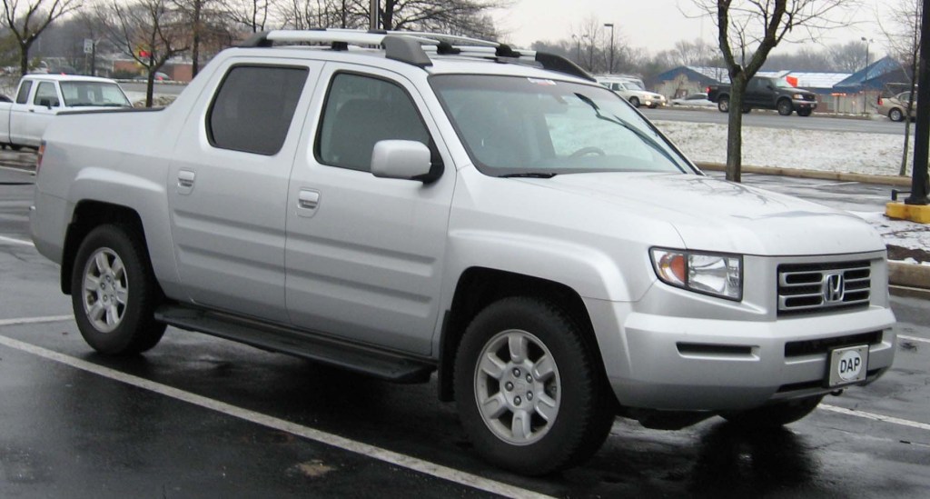 A Honda Ridgeline sits in a parking lot as a midsize truck.