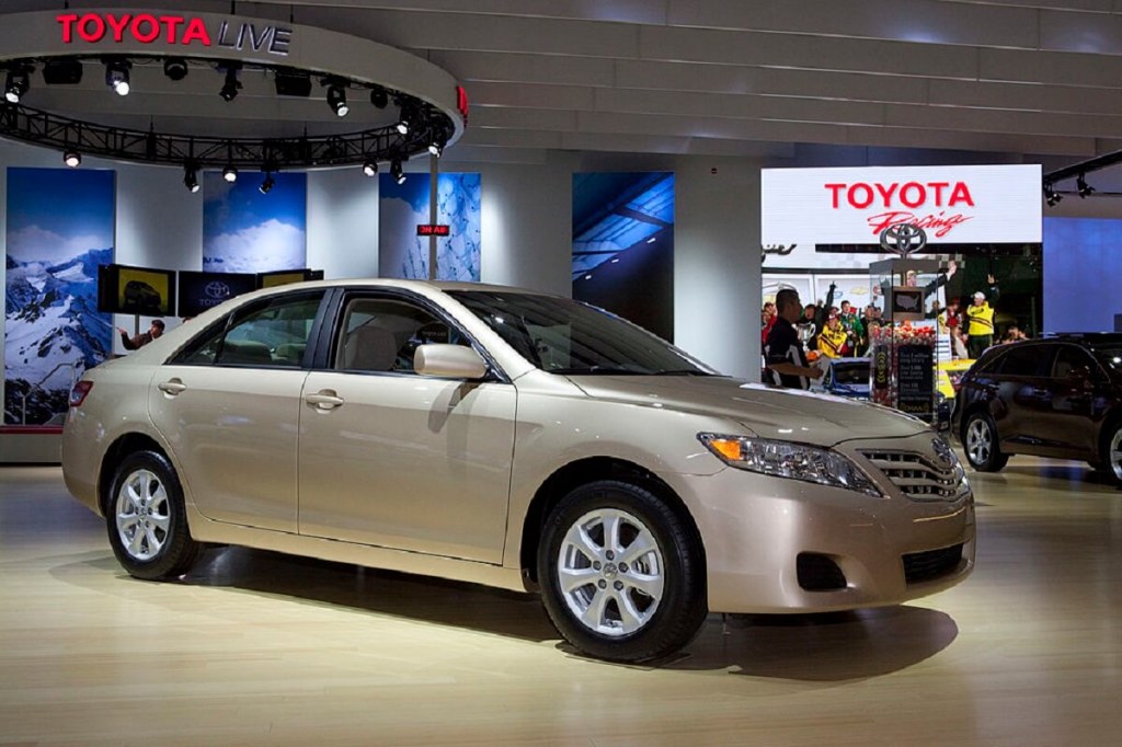 A gold 2009 Toyota Camry at a show. 