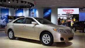 A gold 2009 Toyota Camry at a show.