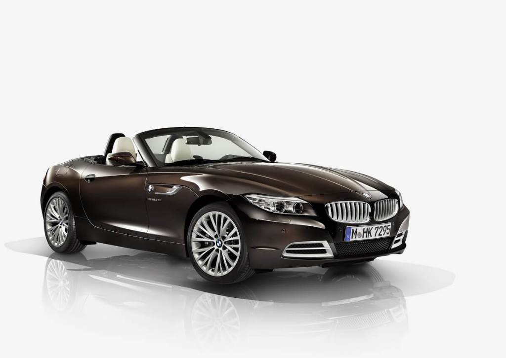 A brown BMW Z4 sports car shows off its convertible top. 