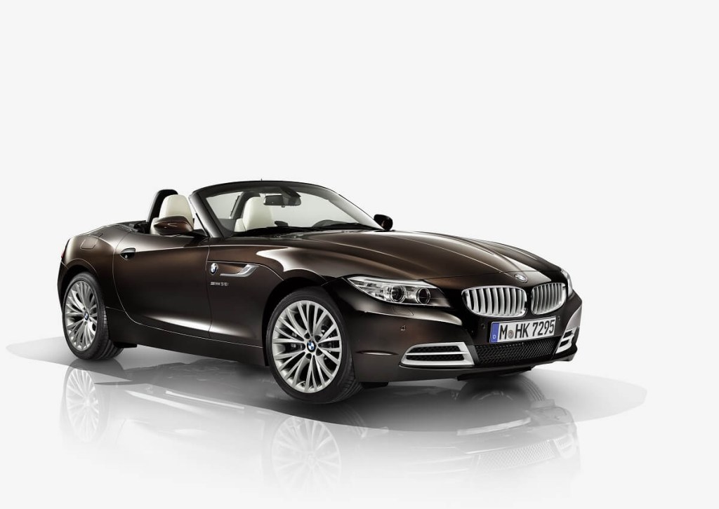 A brown BMW Z4 sports car shows off its convertible top.