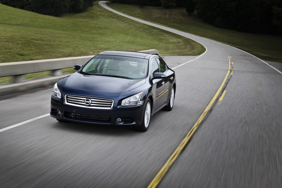 A used 2013 model year Nissan Maxima corners on back roads.
