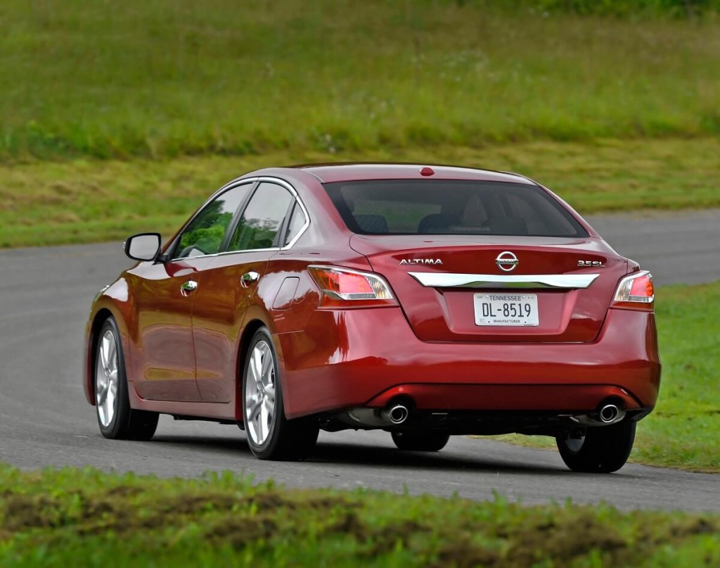 A red 2014 Nissan Altima shows off its rear-end styling. 