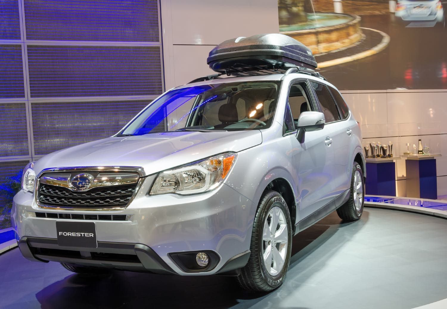A 2014 Subaru Forester on display at an auto show. The 2014 Forester is one of the worst Subaru Forester models to buy used.