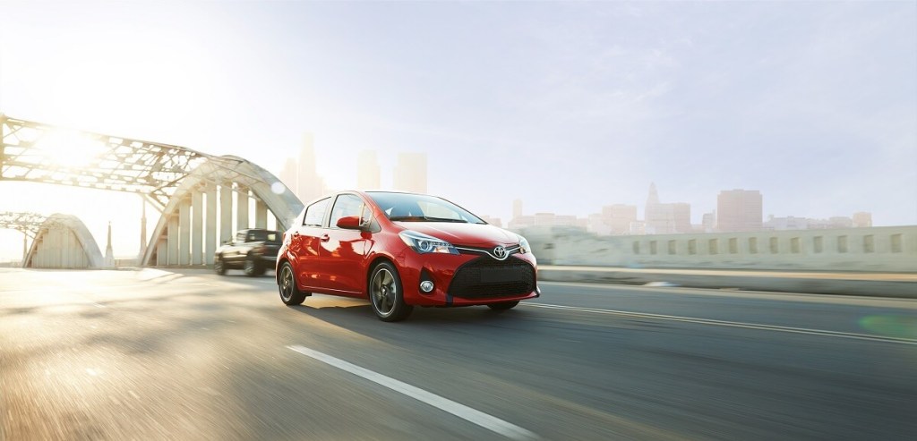 A used 2016 Toyota Yaris shows off its hatchback car proportions. 