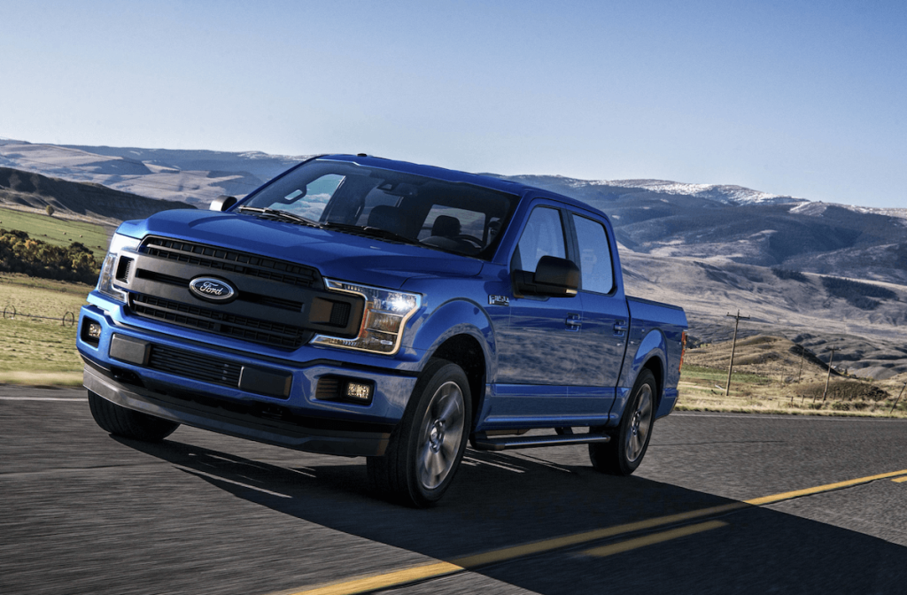 Blue 2018 Ford F-150 on highway